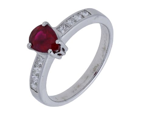 A ruby and diamond ring, the pear-shaped ruby claw-set to princess-cut diamond shoulders, stamped ‘750’, total diamond weight