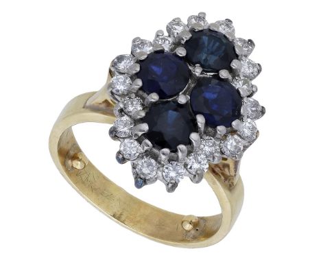 A sapphire and diamond cluster ring, the lozenge-shaped cluster comprising four circular-cut sapphires claw-set within a surr