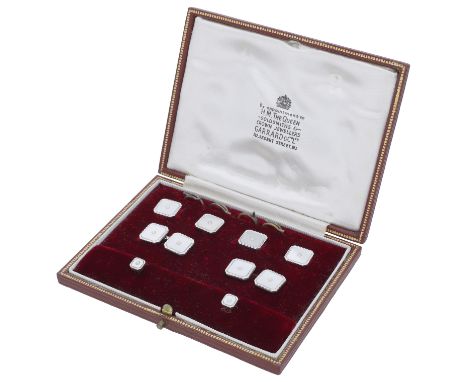 A 9ct white gold and mother-of-pearl gentleman’s dress set, comprising a pair of cufflinks, four buttons and two dress studs,