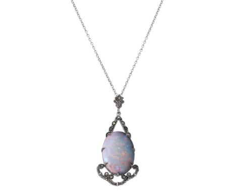 An opal pendant, the oval opal cabochon in a geometric surround set with faceted marcasite, on a cable-link chain, pendant le