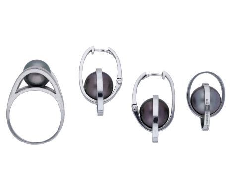 An 18ct white gold and cultured pearl suite by Boodles, the earrings each set with a cultured pearl of black tint within a pa