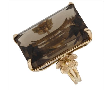 A smoky quartz dress ring, the large step-cut smoky quartz with ropetwist detailing and flowerhead decoration to the mount, b