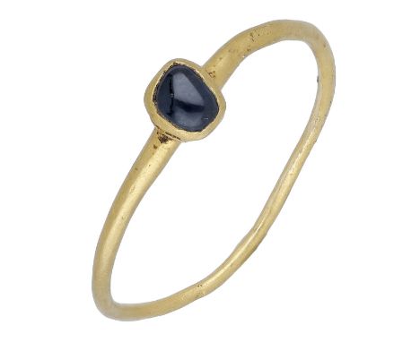 A Medieval gold ring, late 13th century,  the sub-square elevated bezel set with the original cabochon sapphire, in simple co