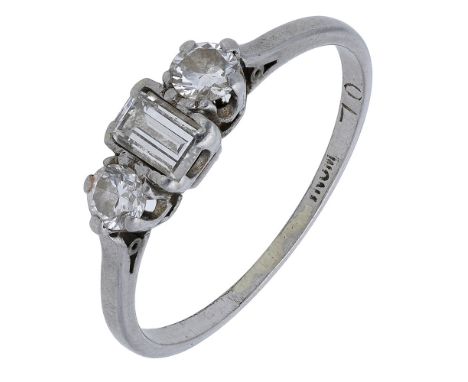 A three stone diamond ring, the step-cut diamond semi-collet set between two brilliant-cuts, total diamond weight approximate