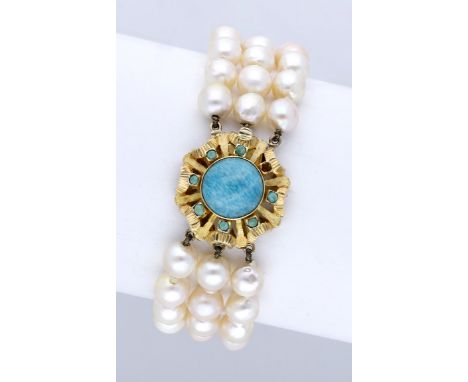 A cultured pearl bracelet with gem-set clasp, the three rows of cultured pearls to a textured pierced clasp set with an amazo