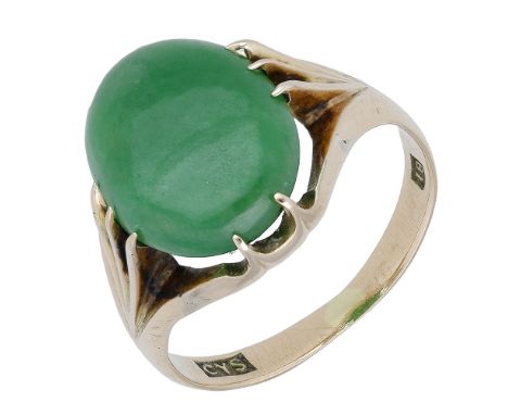 A jade ring, the jadeite cabochon to an open claw setting, stamped ‘18’, maker’s mark ‘CYS’, ring size approximately O (band 
