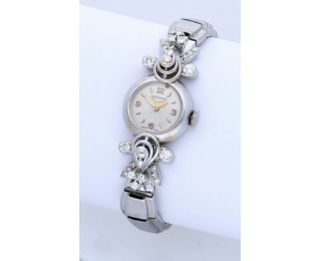 Longines. A lady’s  gold and diamond-set cocktail watch, circa 1956. Movement: cal.13.5V, manual winding, no. 10151667. Dial: