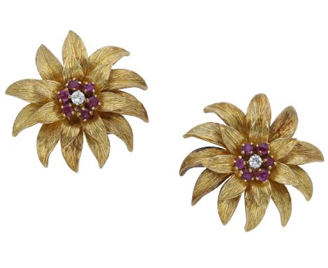 A pair of ruby and diamond flower earrings by Tiffany & Co., circa 1960, the textured flower heads set with a circular-cut ru