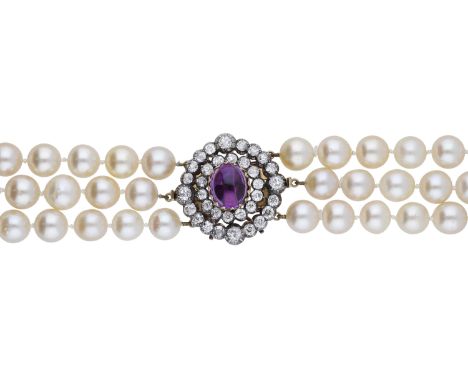 A cultured pearl necklace with diamond and amethyst set clasp, the three uniform strands of cultured pearls to a late 19th ce