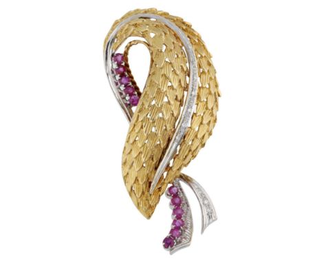 A mid 20th century ruby and diamond spray brooch, the textured leaf with single-cut diamond vein and circular-cut ruby stem, 