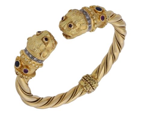 A gem-set bangle by Lalaounis, the hinged ropetwist bangle terminating to either side in a Chimera head, with single-cut diam