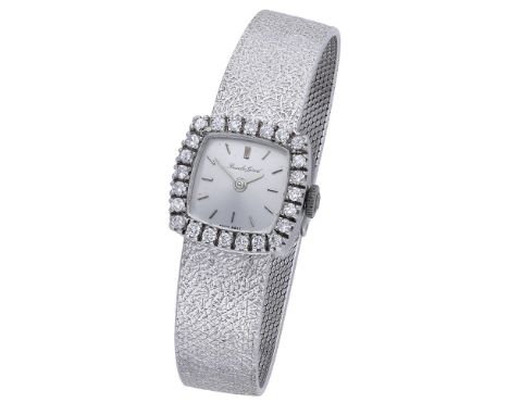 Bueche-Girod. A lady’s white gold and diamond-set bracelet watch, circa 1968. Movement: manual winding, 17 jewels. Dial: silv