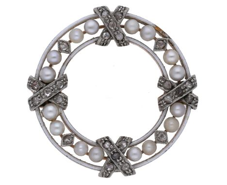 An early 20th century enamel, seed pearl and diamond brooch, the white enamel circlet with a row of seed pearls interspersed 