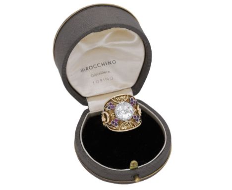 A diamond dress ring, set with an old cushion-shaped diamond weighing 2.99 carats, in a circular plaque surround decorated wi