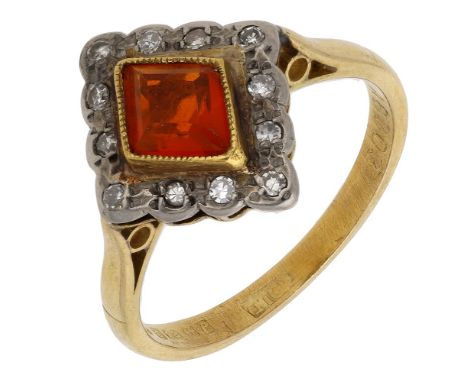 A fire opal and diamond ring, the lozenge-shaped opal collet-set within a surround of  single-cut diamonds, mounted in 18ct g