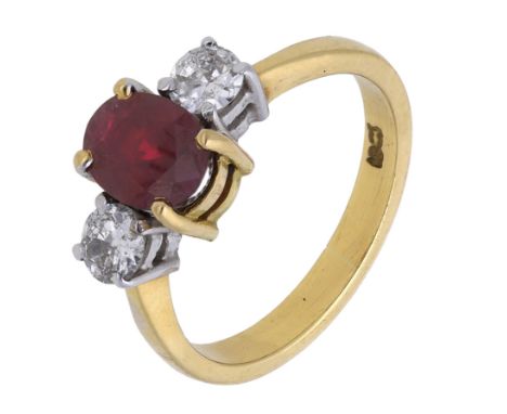 A ruby and diamond three stone ring, the oval mixed-cut ruby claw set between two brilliant-cut diamonds, stamped ‘18ct’, tot