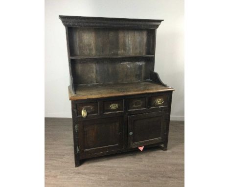 18TH CENTURY OAK DRESSER,with carved and moulded cornice over a single shelf, the base fitted with four short drawers over tw