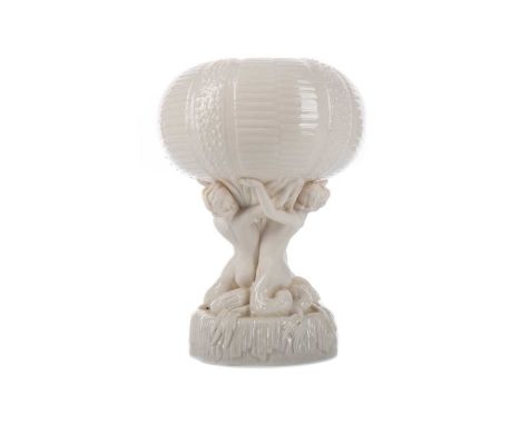 BELLEEK 'MERMAID' PEDESTAL BOWL,first period, the textured sea urchin form bowl raised over three mermaids, on a star shaped 