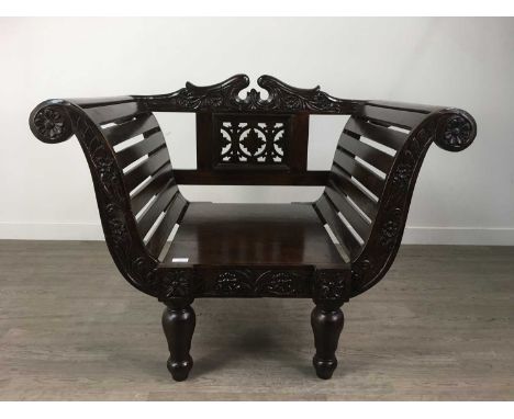 STAINED HARDWOOD BENCH AND CHAIR,with carved and pierced detail, on turned supports, the bench approximately 205cm wide (2)