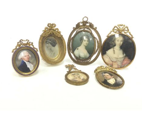 LATE 19TH CENTURY GILTMETAL PICTURE FRAME,ribbon surmount, with blue enamel border, easel backed support with hanging hoop, i
