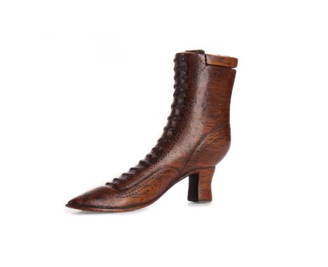 19TH CENTURY TREEN SNUFF BOX,modelled in the form of a high heeled boot, inlaid spelter, 6.8cm high
