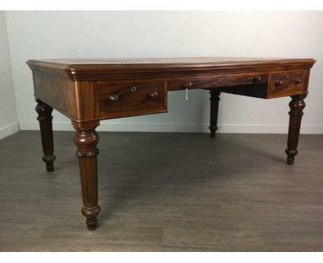 LARGE VICTORIAN MAHOGANY DESK,with red leather skiver and three drawers, on carved and tapered supports to substantial peg fe