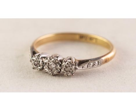 18ct GOLD AND PLATINUM RING with three small diamonds in deceptive settings, 0.05ct in total, 2.6 gms, ring size N/O 