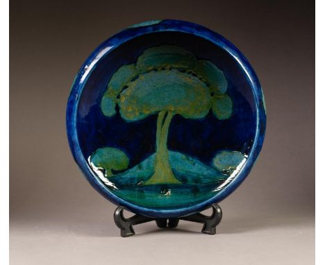 WILLIAM MOORCROFT POTTERY 'MOONLIT BLUE TREE LANDSCAPE' PATTERN SHALLOW BOWL, with inverted turn-over rim, the foot ring stai