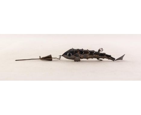 STERLING SILVER ARTICULATED FISH with blue stone set eyes, 2 3/4in (7cm) long, suspended on a FINE CHAIN from a STICK PIN, (9