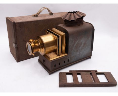 A late 19th/early 20th century tinplate Magic Lantern, the lacquered brass lens with rack and pinion focus, together with a w