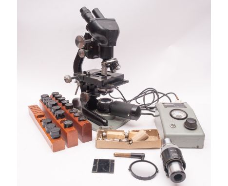 A Watson Barnet Bactil Binocular Microscope, serial number 125694, black frame with rack and pinion coarse/fine adjust, tripl