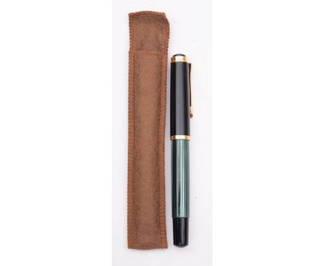 A Pelikan 400 piston fill fountain pen in green and black stripes having Pelikan 14ct gold nib- wear to barrel