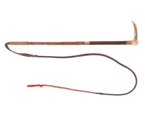 A Swaine  & Adney 15ct gold mounted riding whip, London 1903,  the antler handle over a leather and bamboo shaft with two  go