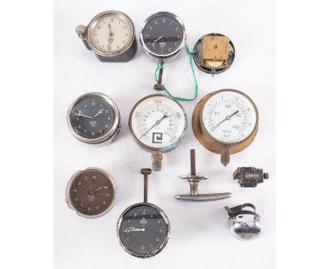 A group of five various Smiths dashboard clocks, together with a similar clock movement, two pressure gauges, a Lucas Kind of