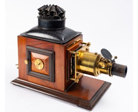 A late 19th/early 20th century mahogany and brass Magic Lantern, unsigned, black tinplate chimney over mahogany body with bra