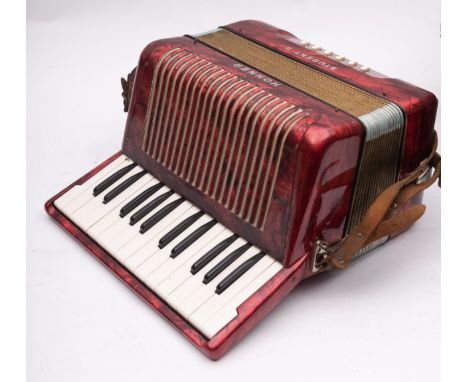 A Hohner Student II accordion, in red pearl finish, cased.