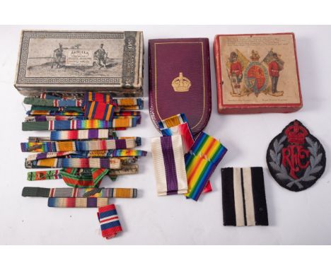 The remaining personal effects of Harwood Steele (1897-1978):  a Royal Flying Corp patch, a tin of medal ribbons, a Military 