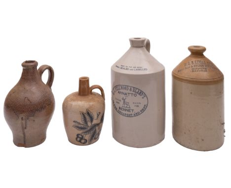 A group of four stoneware bottles, one stamped 'W&S Lucas Ltd Brewers & Spirit Merchants Hitchin', another stamped 'Port-Dund