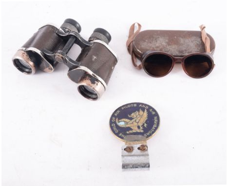 A pair of Leitz Wetzlar 6x30 binoculars, together with a pair of Carl Zeiss W15 Umbral sunglasses, and a Guild of Air Pilots 