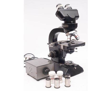 Cook & Troughton & Simms. A black lacquer binocular microscope, serial number M25731, with coarse/ fine adjust focus, triple 
