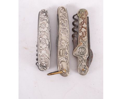 Three Art Nouveau ornate silver metal knives, including one marked 'STERLING' (3)