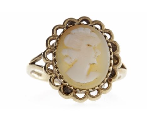 NINE CARAT GOLD CAMEO RINGset with an oval cameo carved to depict a female in profile facing right, pierced border, the bezel
