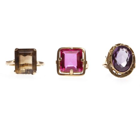 THREE GEM SET RINGSincluding one smoky quartz and one amethyst example, all unmarked, 26g gross 