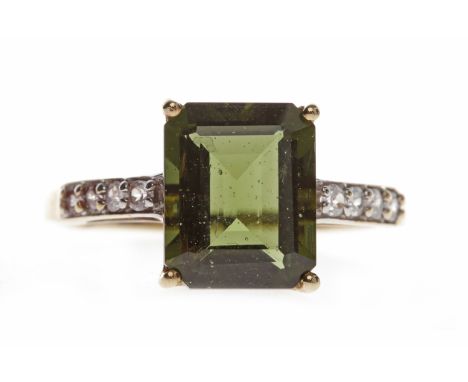 NINE CARAT GOLD GEM SET RINGwith a rectangular green gem 10.5x8.4mm, on gem set shoulders, size R-S, 2.8g