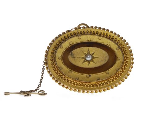 VICTORIAN FIFTEEN CARAT GOLD BALLOON BROOCHof oval form, with a central star set pearl, within a polka dot border, within a f