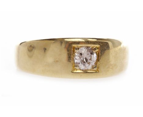 EIGHTEEN CARAT GOLD DIAMOND SET BANDset with a round brilliant cut diamond of approximately 0.15 carats, the band 6.6mm wide,