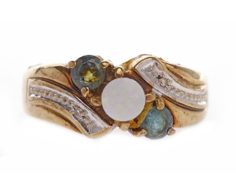 NINE CARAT GOLD GEM SET RINGset with a central opal doublet flanked by two round blue gems, on bi colour crossover style shou