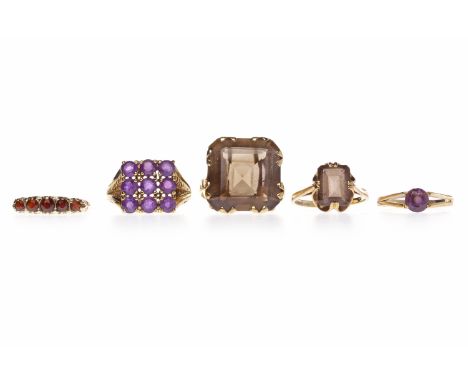 GROUP OF VARIOUS NINE CARAT GOLD RINGSincluding one set with a large smoky quartz, size R, 19g gross