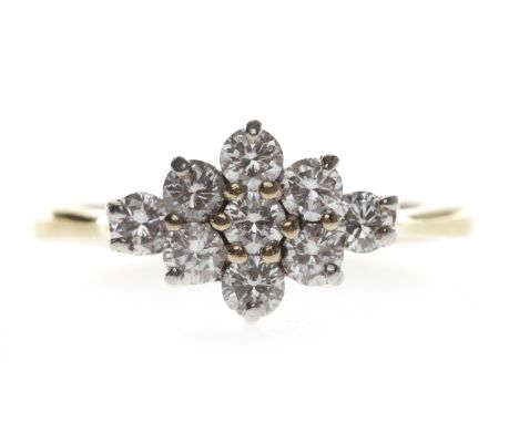 EIGHTEEN CARAT GOLD DIAMOND CLUSTER RINGthe bezel of rhombic form and set with round brilliant cut diamonds, the diamonds tot