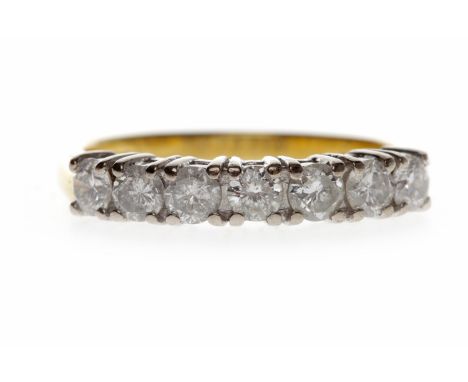 EIGHTEEN CARAT GOLD DIAMOND SEVEN STONE RINGset with round brilliant cut diamonds totalling approximately 0.70 carats, size M